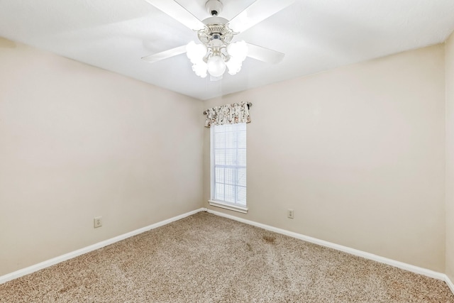 unfurnished room with ceiling fan and carpet floors