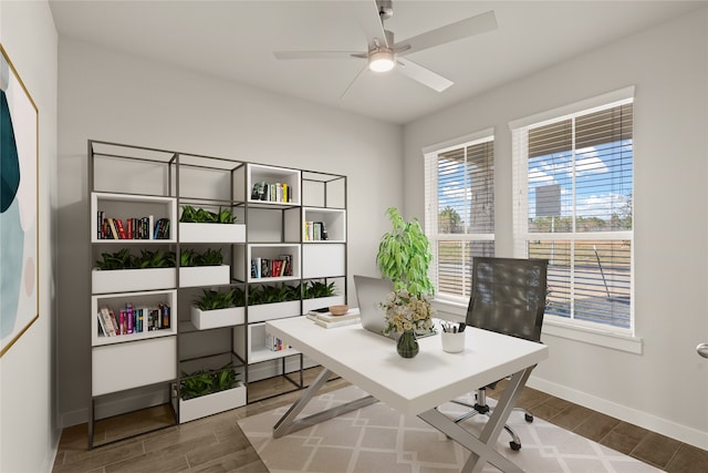 office area featuring dark wood-type flooring and ceiling fan