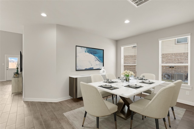 dining area featuring hardwood / wood-style flooring and a wealth of natural light