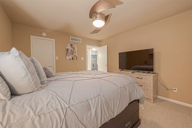 carpeted bedroom featuring ceiling fan