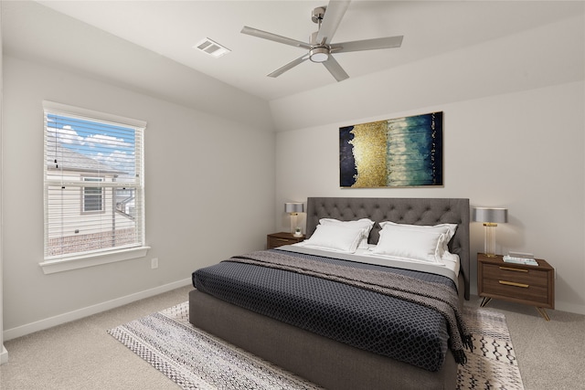 carpeted bedroom featuring lofted ceiling and ceiling fan