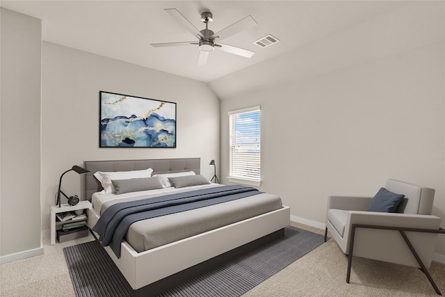 carpeted bedroom featuring vaulted ceiling and ceiling fan