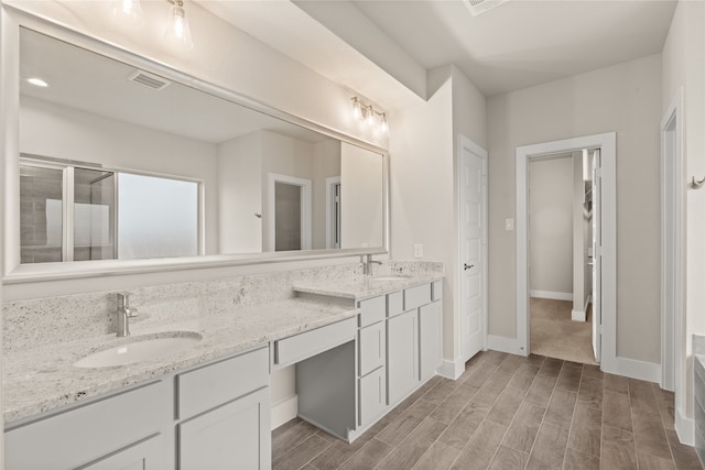 bathroom featuring hardwood / wood-style floors and vanity