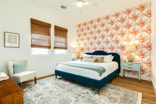 bedroom featuring hardwood / wood-style floors and ceiling fan