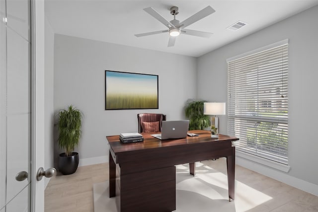 office featuring light wood-type flooring and ceiling fan