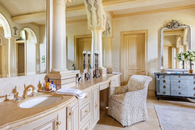 bathroom with ornamental molding, decorative columns, beam ceiling, and vanity