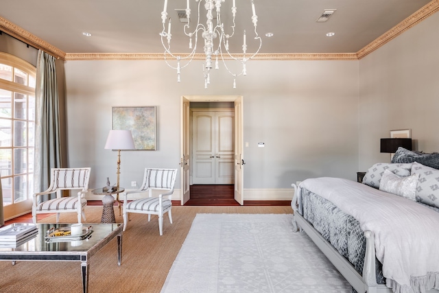 bedroom featuring a notable chandelier, crown molding, and hardwood / wood-style flooring