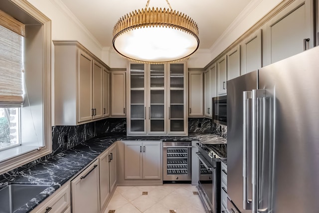 kitchen featuring wine cooler, ornamental molding, tasteful backsplash, appliances with stainless steel finishes, and dark stone counters