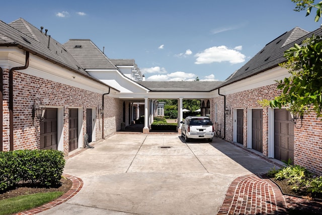 view of patio / terrace featuring a garage and a carport