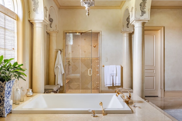 bathroom with ornamental molding, separate shower and tub, and ornate columns