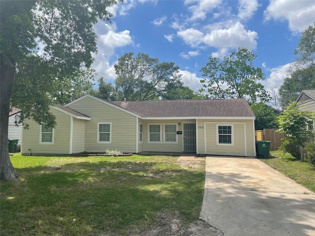 ranch-style home with a front yard