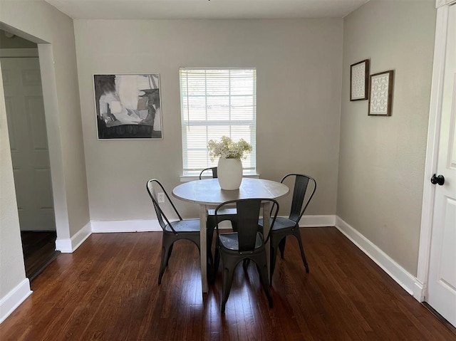 dining room with dark hardwood / wood-style floors