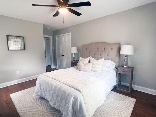 bedroom with ceiling fan, a closet, and dark hardwood / wood-style flooring