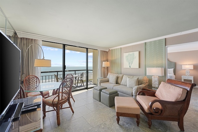 living room with a wall of windows and a water view