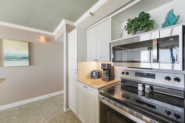 kitchen with stainless steel appliances, light stone countertops, white cabinets, and ornamental molding