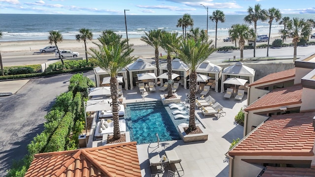 bird's eye view with a view of the beach and a water view