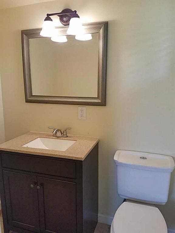 bathroom with vanity and toilet