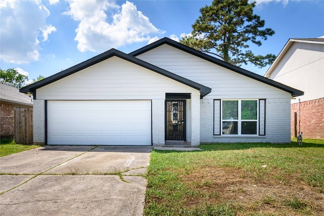 single story home with a garage and a front yard