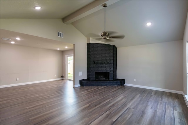 unfurnished living room with wood-type flooring, beam ceiling, high vaulted ceiling, a brick fireplace, and ceiling fan