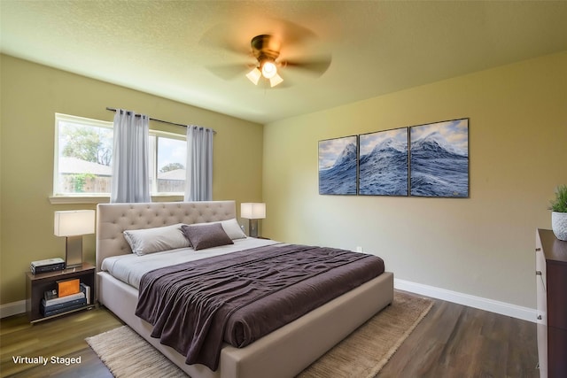 bedroom featuring wood-type flooring and ceiling fan