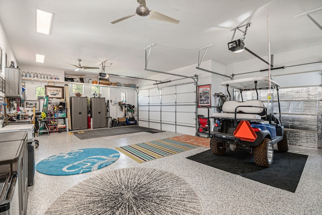 garage with ceiling fan and a garage door opener