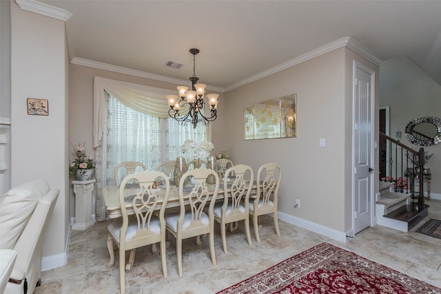 dining space featuring ornamental molding and an inviting chandelier