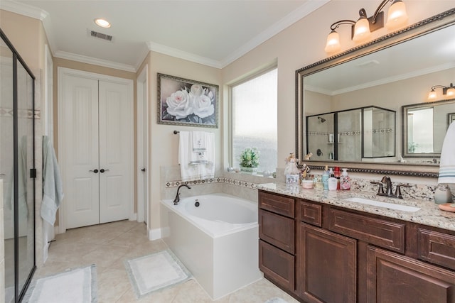 bathroom with ornamental molding, tile patterned floors, independent shower and bath, and vanity