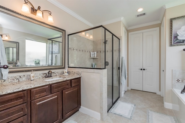 bathroom with vanity, plus walk in shower, crown molding, and tile patterned flooring