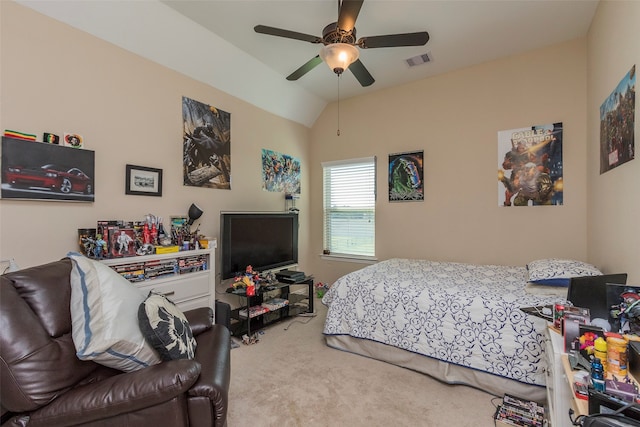 bedroom with ceiling fan, lofted ceiling, and carpet flooring