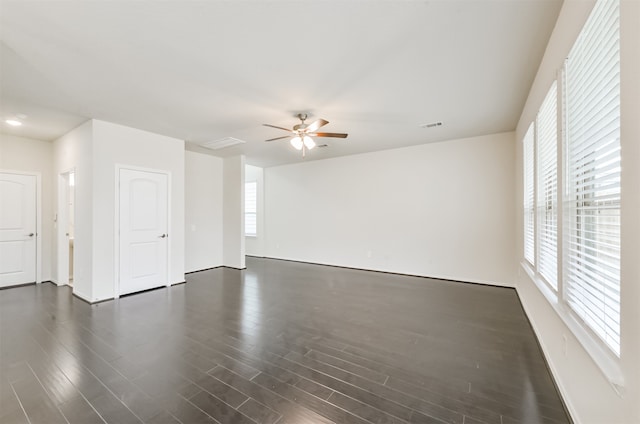 unfurnished room featuring ceiling fan and dark hardwood / wood-style floors