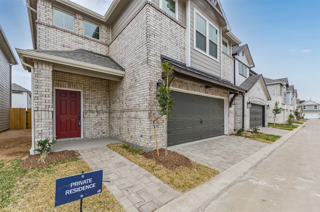 townhome / multi-family property featuring a garage