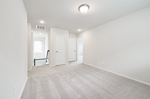 unfurnished bedroom with light carpet