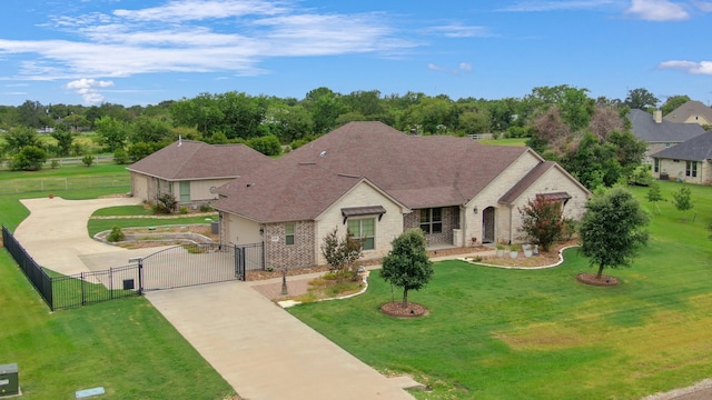 view of front of property with a garage and a front lawn