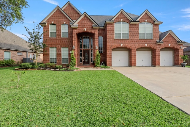 view of front property with a garage, a front lawn, and central AC unit