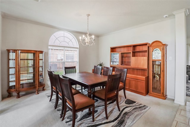 dining space featuring ornamental molding, an inviting chandelier, and light carpet