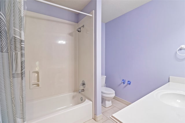 full bathroom with a textured ceiling, tile patterned flooring, shower / tub combo with curtain, toilet, and sink