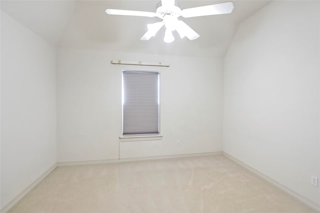 unfurnished room with lofted ceiling, light carpet, and ceiling fan