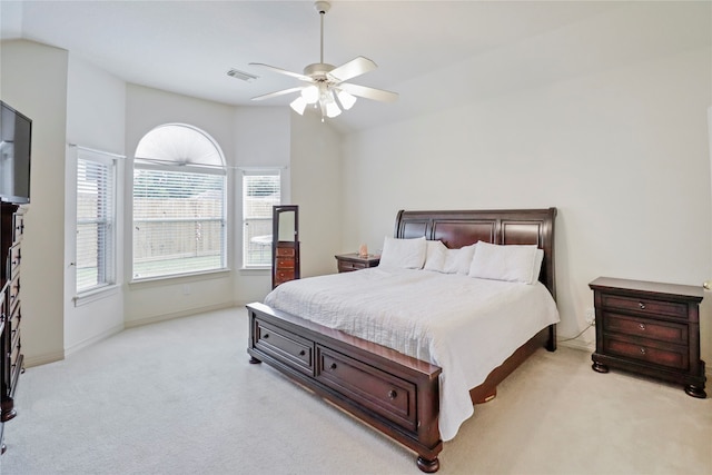 carpeted bedroom featuring lofted ceiling and ceiling fan