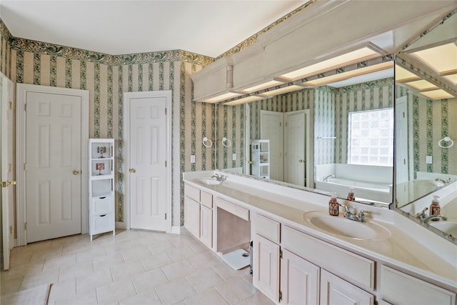 bathroom featuring a tub to relax in and vanity