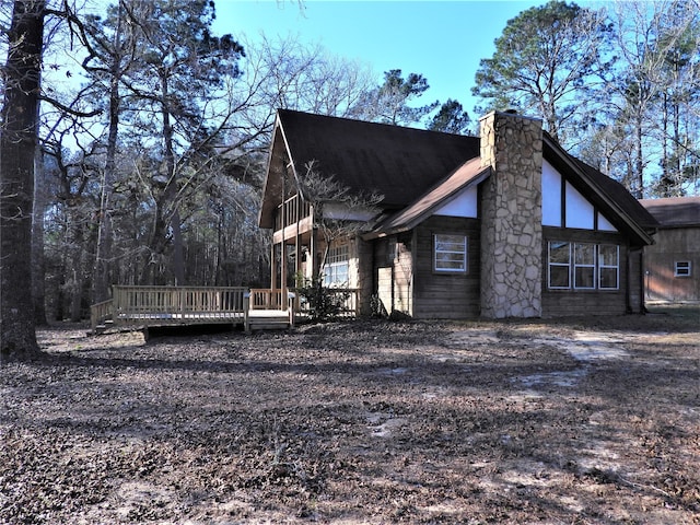 view of home's exterior with a deck