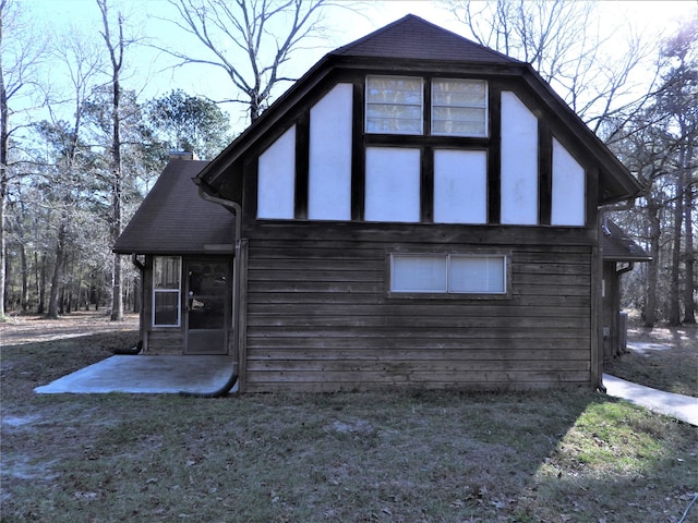 view of home's exterior with a yard