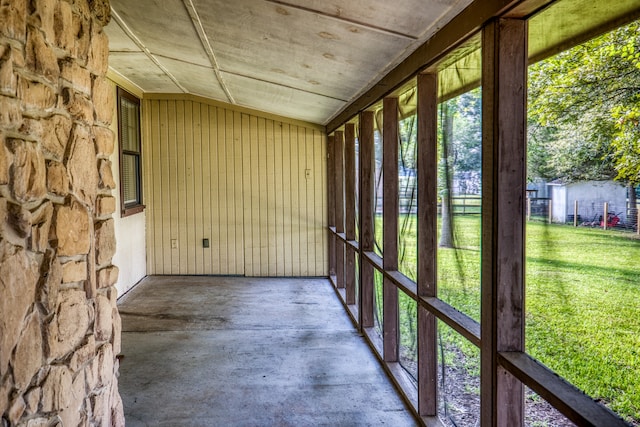 unfurnished sunroom with vaulted ceiling