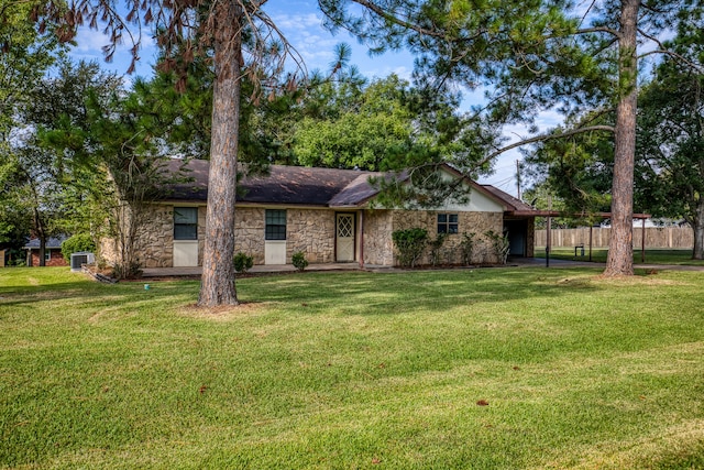 rear view of property with a lawn