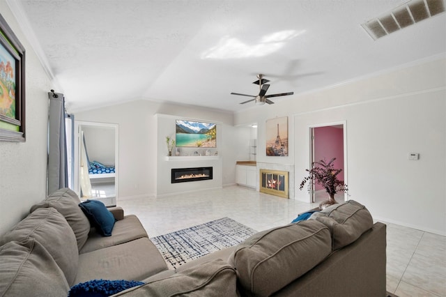 tiled living room with lofted ceiling, ceiling fan, crown molding, and a textured ceiling