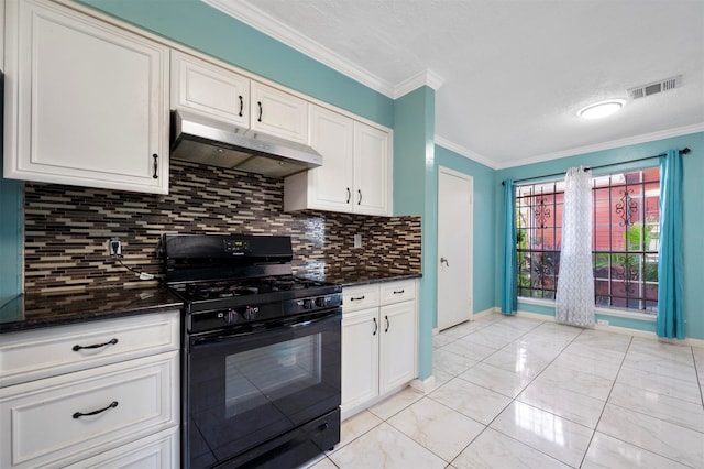 kitchen featuring white cabinetry, tasteful backsplash, gas stove, dark stone counters, and ornamental molding