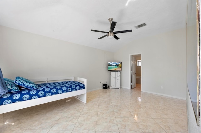 bedroom featuring vaulted ceiling, ceiling fan, and ensuite bathroom