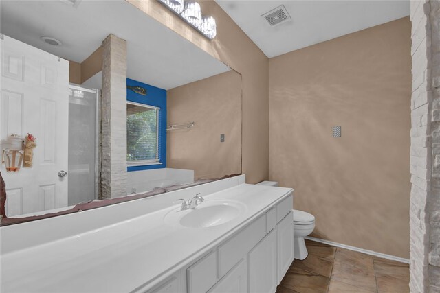 bathroom featuring walk in shower, vanity, and toilet