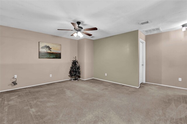 carpeted empty room featuring ceiling fan