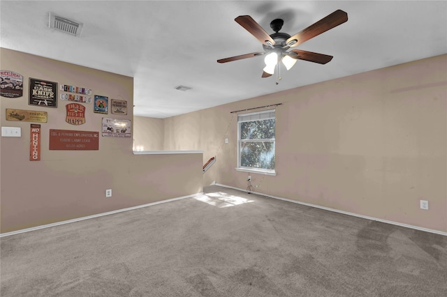 carpeted empty room with ceiling fan