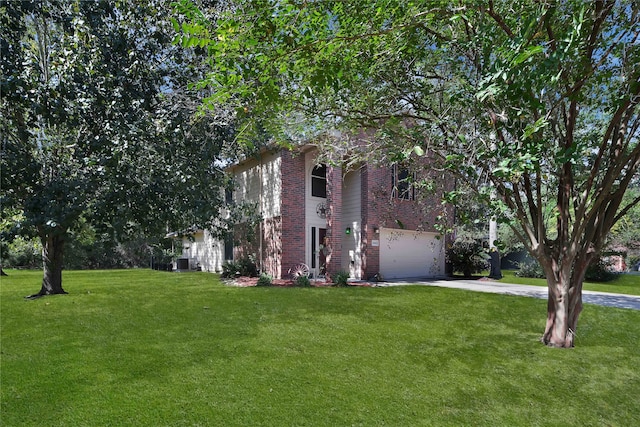 view of front of property featuring a garage and a front lawn